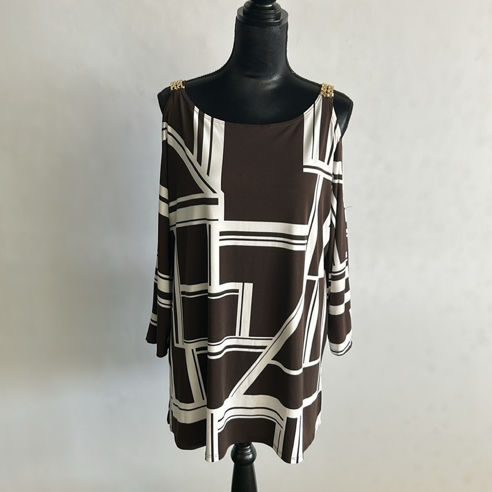 Chico’s cold shoulder tunic. Brown /white. Gold accents. Sz 3(L)
A101 - Picture 2 of 7